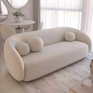 Modern Minimalist Curved Cream Fabric Sofa with Spherical Bolster Pillows - Image 1