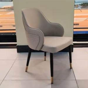 Elegant Beige Leatherette Dining Chair with Black and Gold Legs - Image 1