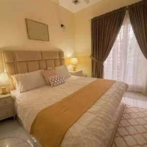 Elegant Deco Beige Upholstered Bed with Luxury Gold Lighting Accents - Image 2